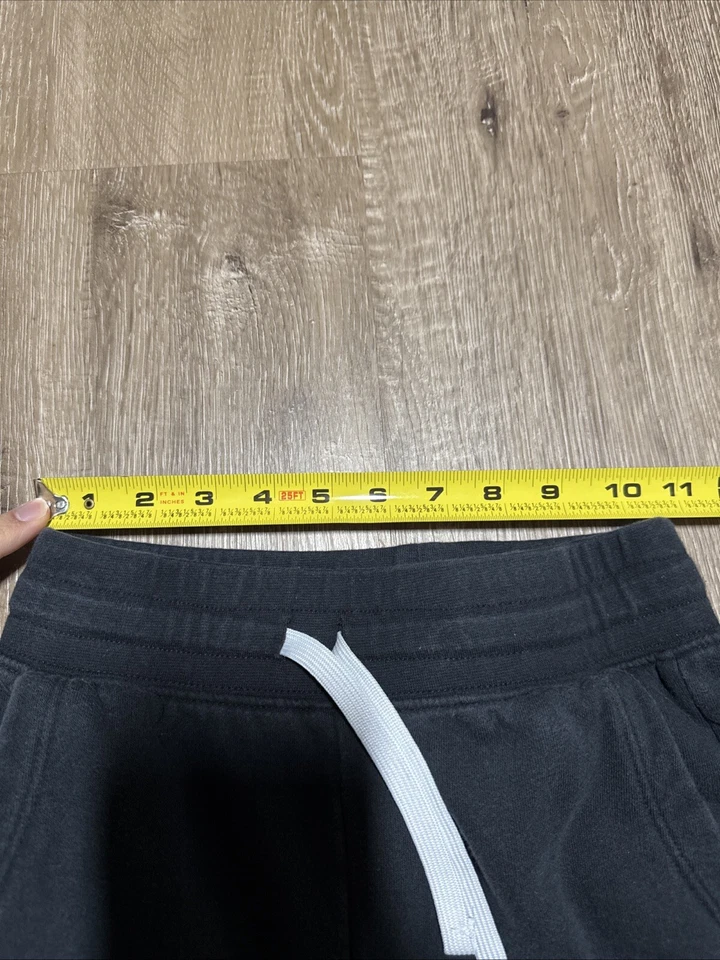 Pantalones deportivos Under Armour niñas jóvenes medianos negros calce holgado Foto 4 de 4