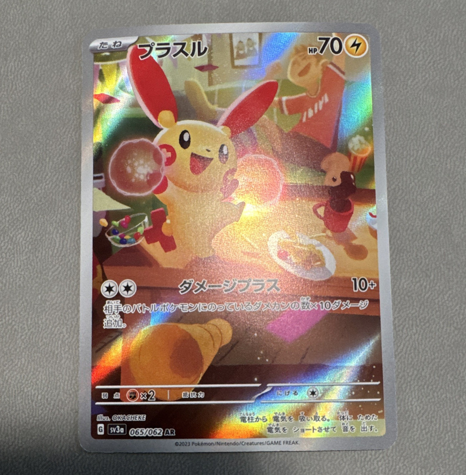 The Pokémon Company Pokémon TCG Plusle 065/062 Sv3a Raging Surf AR Holo JP 70HP