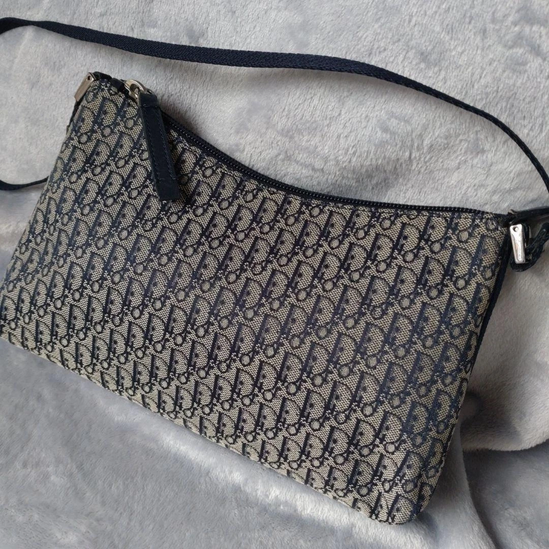 Pochette bandoulière trotteur Christian Dior toile marine et cuir occasion 15x25cm
