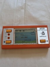 De colección Gakken Juego Y Reloj LCD Juego de Cartas Jumping Boy Consola Portátil 1980