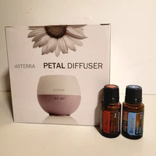 Brand New Unopened Doterra Petal Diffuser W/ 15 ml Bottles Of BREATHE & ON GUARD