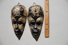 Handmade African Masks 8 1/2 inches tall, 4 inches wide. Balck with white floral