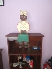 Black women folk art I think. nice kitchen peace.