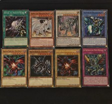 LOT DE CARTES DRAGON BLANC AUX YEUX BLEUS ET DRAGON NOIR AUX YEUX ROUGES YU-GI-O