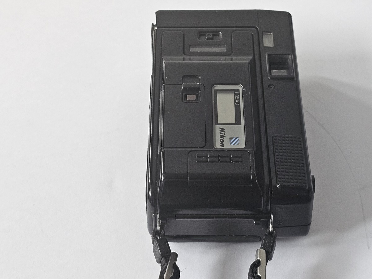 Nikon L35 AF Film CAMERA for RESTORATION 35mm lens f/2.8 ISO Nikon L35 AF Film CAMERA for RESTORATION 35mm lens f/2.8 ISO