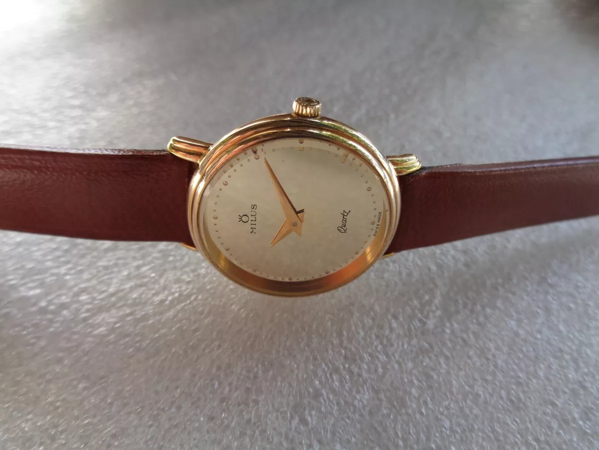 Milus gold watch clearance