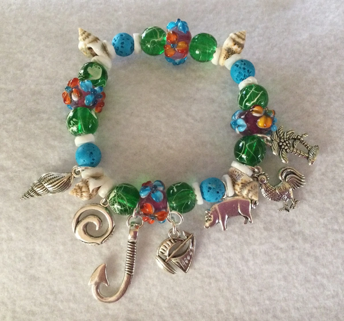 Moana Disney Princess Hawaiian Themed Beaded Stretch Charm Bracelet 7 Charms