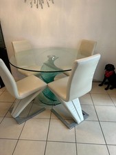 Round glass dinning table with 4 faux leather light cream chairs