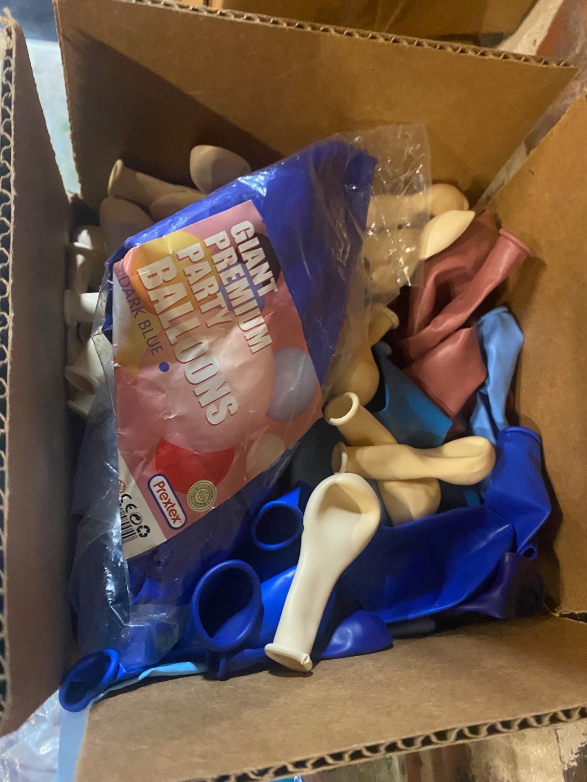 Assorted color balloons in opened bags, minimum 100 per lot