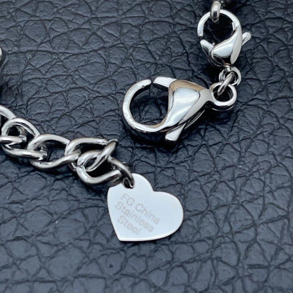 Pulsera con dijes cruzados cuentas de cristal imitación cuero tono plata acero inoxidable  Foto 4 de 4