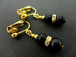 Authentic A PAIR OF DANGLY BLACK ONYX BEAD GOLD PLATED CLIP ON EARRINGS.
