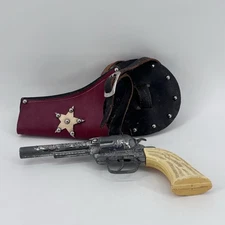 Vintage “Pony Boy” Revolver Cap Shooter. With Mattle Leather Belt Holster.