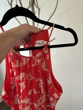 En Creme Red Floral Sleeveless Knee Length A-Line Dress with Ruffle Accents