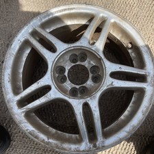 7 x 15 inch 5 spoke alloy wheel,4 x 100 pcd , et 18 ,cb 72.6 , s1570