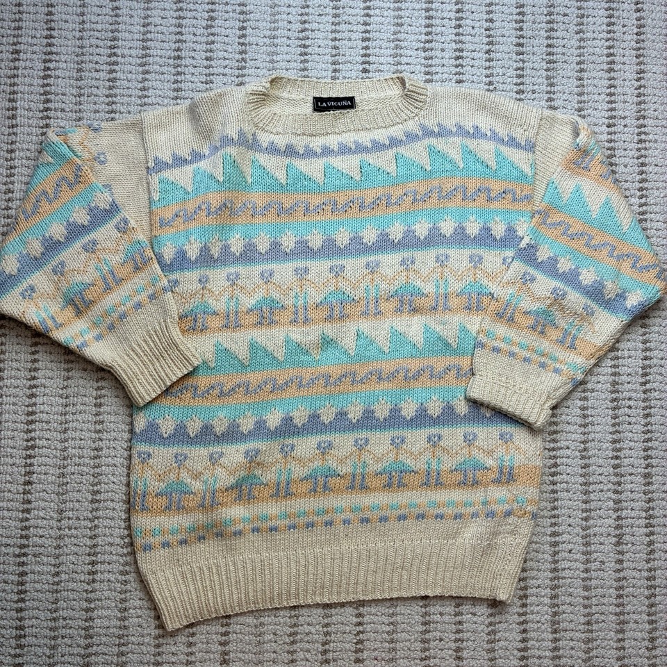 A genuine 90s Fair Isle novelty knit in pastel — the kind of oversized thrift-store score people pay way too much to replicate today.