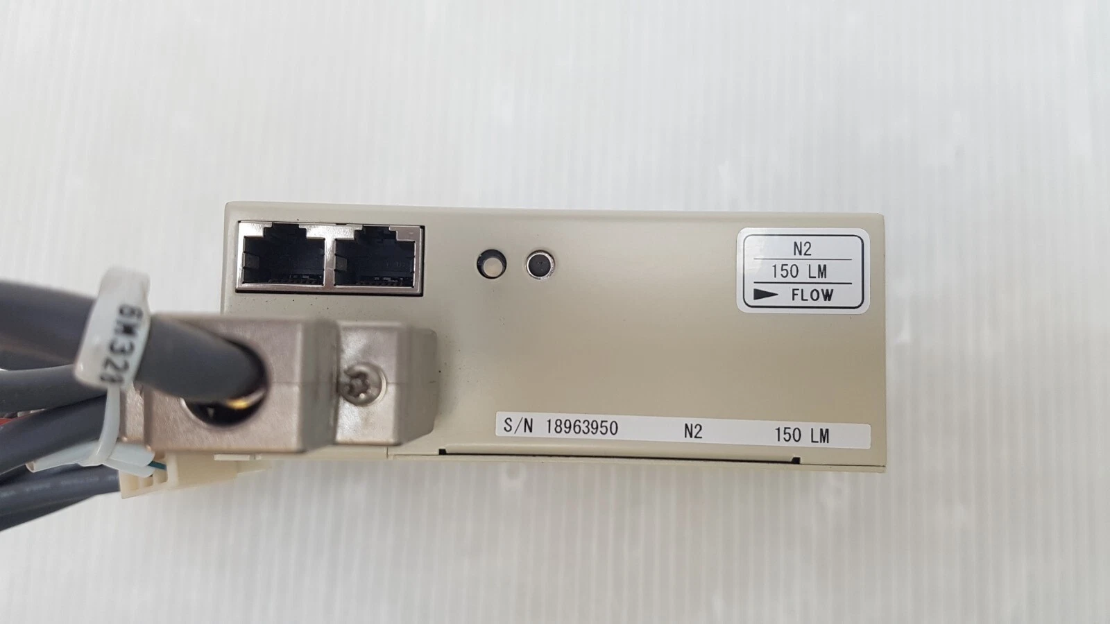 Top of the LINTEC MC-2000L with two RJ-45 jacks, D-sub cable and N2 150 LM flow tag