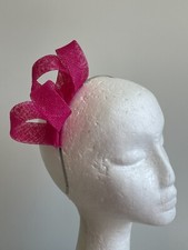 New pink loop fascinator on a silver metal headband.