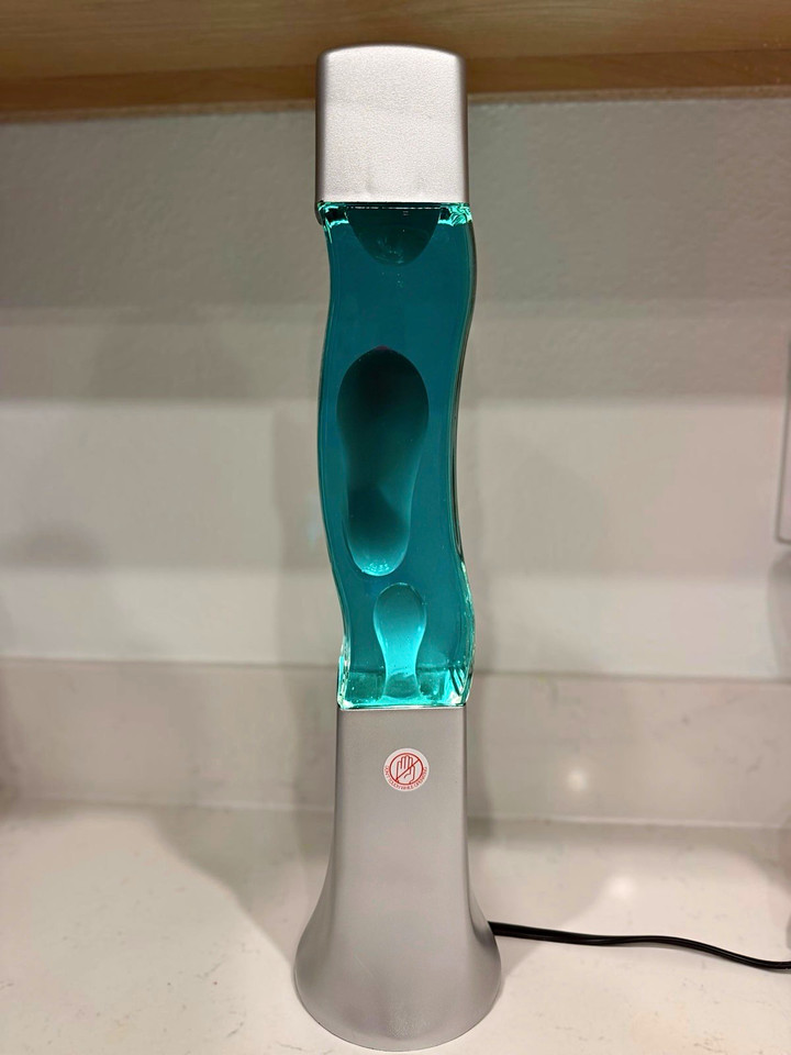 That rare seafoam-and-blue colorway that looks straight out of a 1960s mod boutique — a lava lamp that doubles as sculpture.