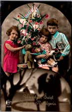 Colorized RPPC Christmas  3 Children Hold Xmas Tree & Toys Real Photo Postcard