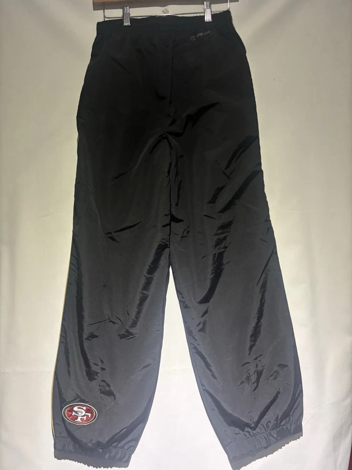 Pantalones cortavientos Reebok negros 49ers NFL talla L Foto 2 de 4