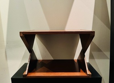 Vintage mid-century modern style distinctive ''X'' shaped leg wooden accent table.