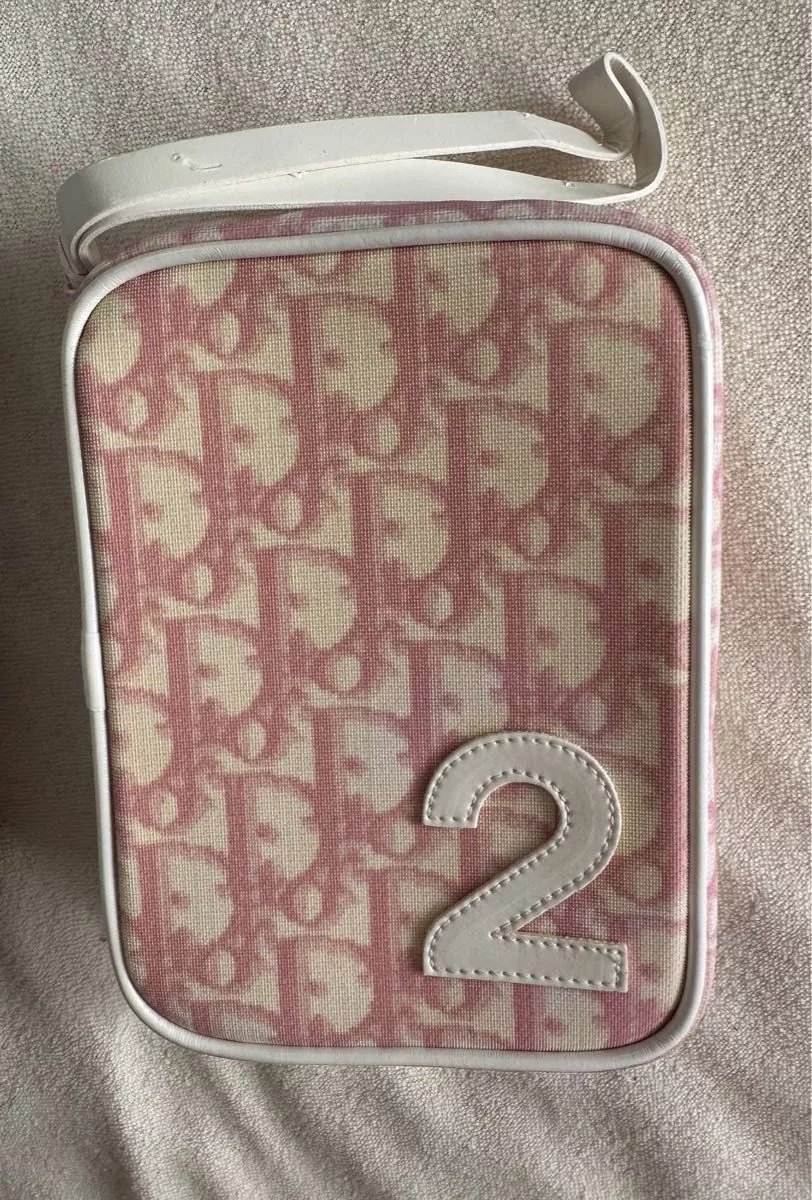 Pochette à maquillage Dior Trotter rose boîte ouverte jamais utilisée 