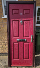 Red composite front door with Rosewood frame. All white inside. 885x2110mm