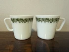 Pair Of vintage Pyrex "Spring Blossom Green" (or "Crazy Daisy") coffee mugs