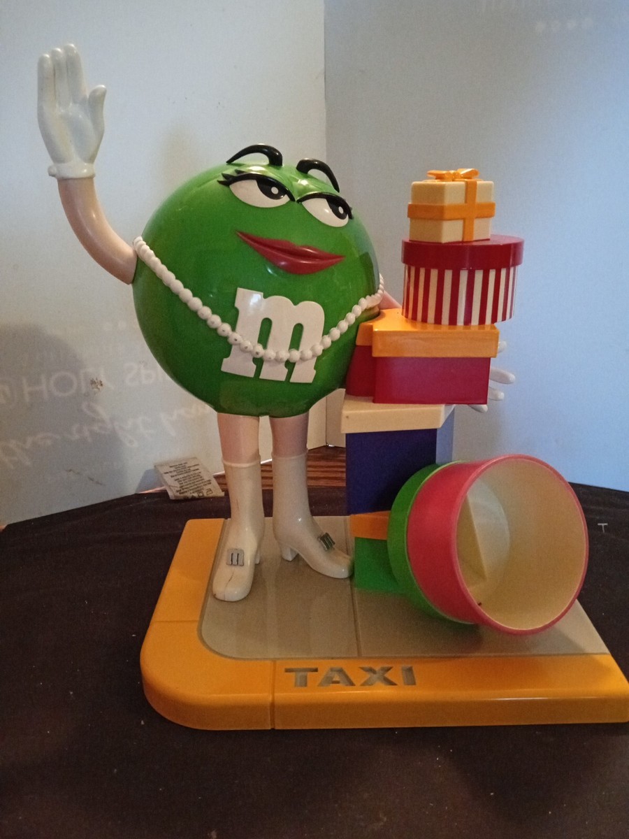 Vintage M&M's Ms. Green Girl M&M Taxi Stand with Gifts Vintage M&M's Ms. Green Girl M&M Taxi Stand with Gifts