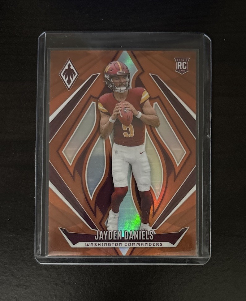 2024 Panini Phoenix - Jayden Daniels #198 Rookie (RC) Orange - Commanders
