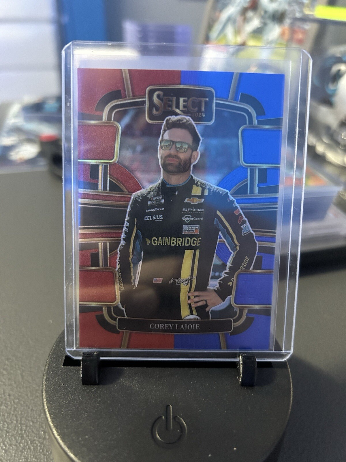 2024 Panini Select Racing Grandstand Red and Blue Prizm #18 Corey Lajoie /249