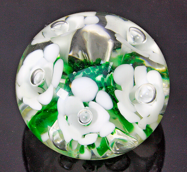GIBSON GLASS PAPERWEIGHT WITH WHITE TRUMPET FLOWERS WITH CONTROLLED