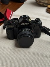 Canon A-1 35mm SLR Film Camera - Black (50mm Lens Kit)