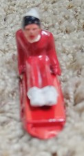 Vintage 1950's Cast Lead Lady on Sled Figurine - Barclay 