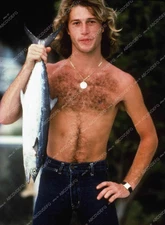 8b20-13724 Andy Gibb shows off his fishing catch 8b20-13724 8b20-13724