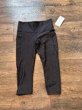 Athleta Salutation Stash 7/8 Tight with Pockets Size medium- Black nwt