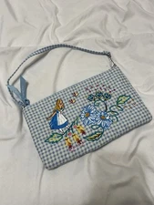 Vera Bradley’s Disney RFID Convertible Wristlet, featuring “Alice in Wonderland”