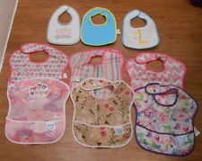 6 BUMKINS ASSORTED GIRLS BIBS AND 3 JAMMI BIBS
