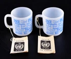 VTG United Nations (2) UN Peace Mugs Cups Multi Language Blue Text Milk Glass