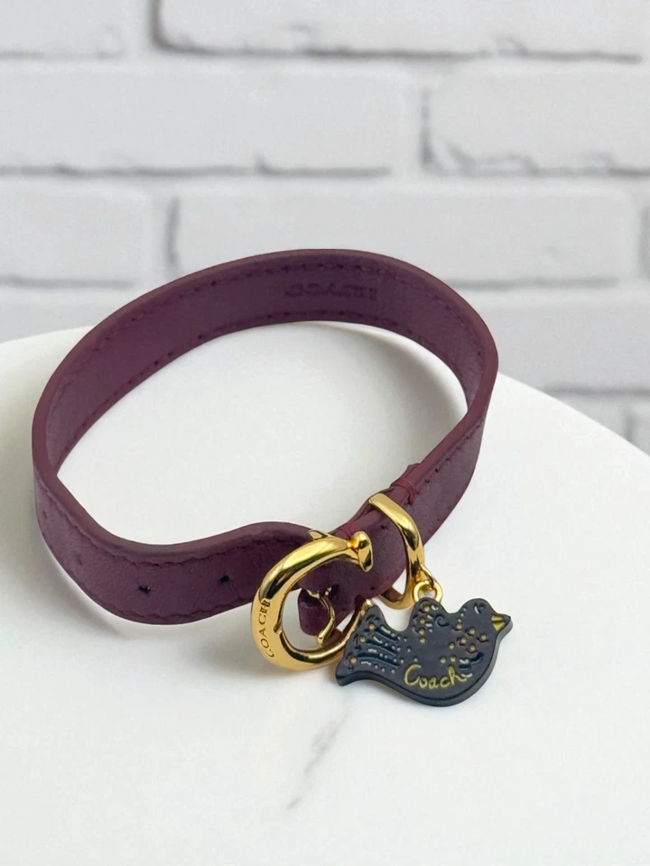 Pulsera Coach Charm Pájaro Dorado Burdeos Sangre de Buey Borgoña Cuero Hebilla Correa Foto 2 de 3