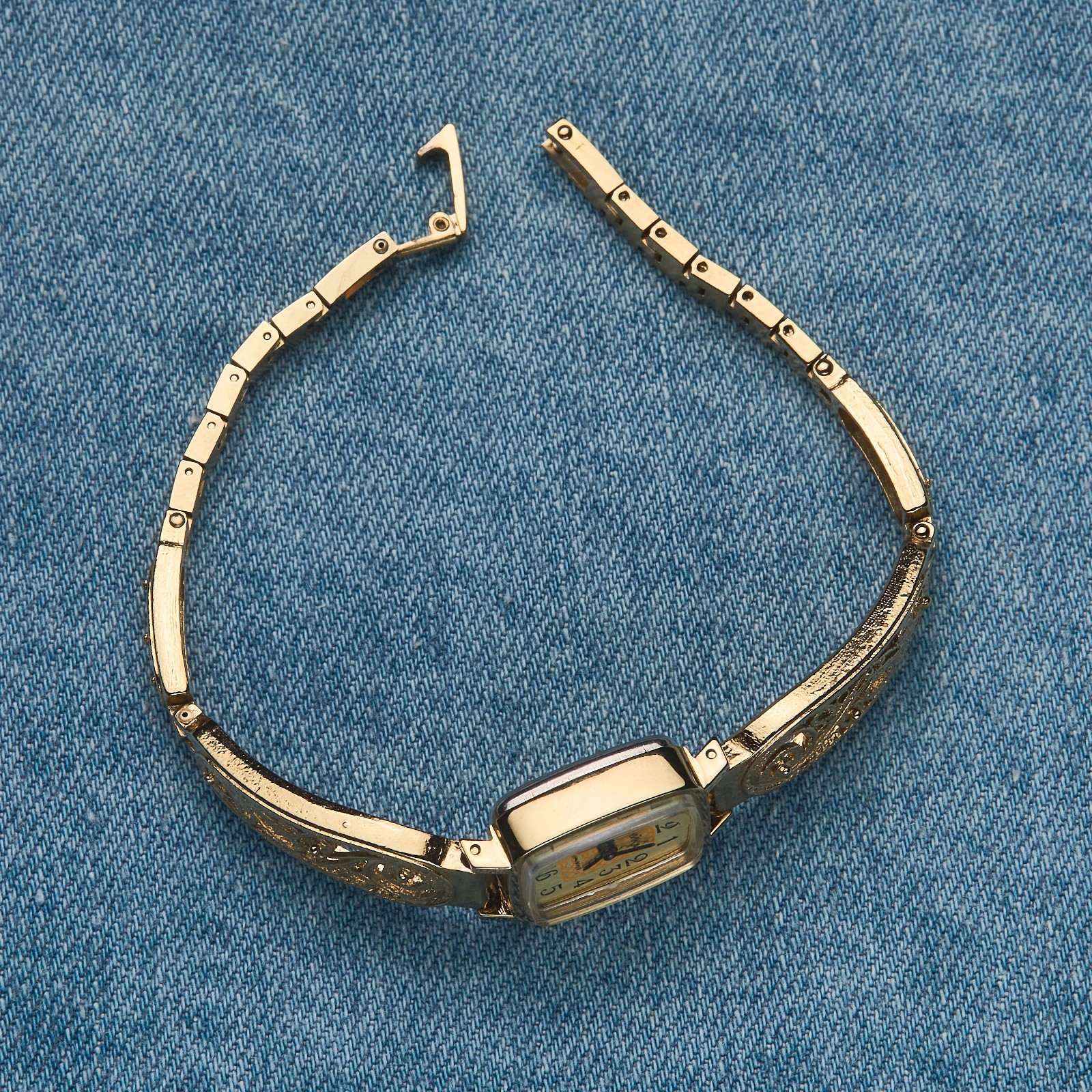 Small women's cocktail watch with gold color. Vintage women's mechanical watch.