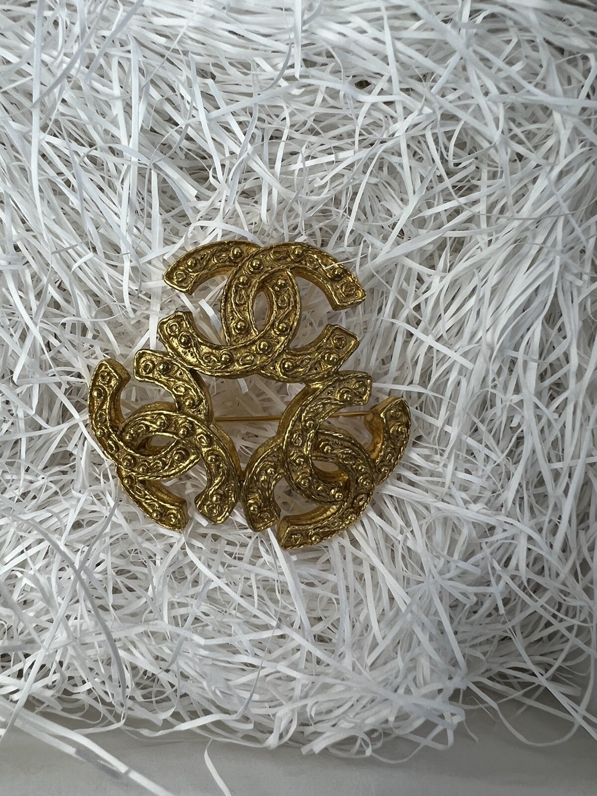 CHANEL Coco Mark Brooch in Shimmering Gold Tone  