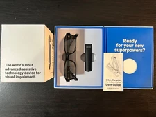 OrCam MyEye 2, Rev B.  Plus OrCam ChargeMe and OrCam Bluetooth earbuds