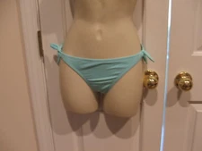 New in pkg famous maker light  aqua Swimsuit Bikini bottom size xs 3-5