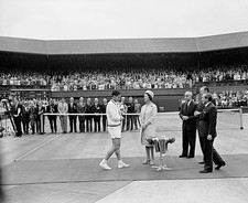 Roy Emerson retreats down red carpet after receiving trophy from P- Old Photo