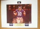 Signed Eli Manning 8x10 color photo matted to 11x14 w/coa