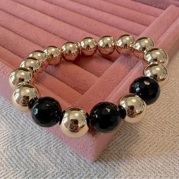 Pulsera elástica bola dorada y negra Park Lane caja brillante 2022 regaliz Foto 4 de 4