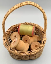 Basket of Vintage Wooden Thread Spools