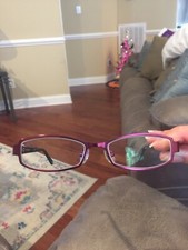 Nine West eyeglasses. Purple rose color metal frames with plastic earpieces.