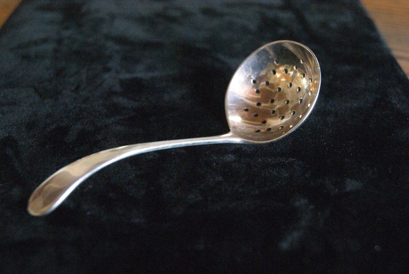 Antique silver tea strainer